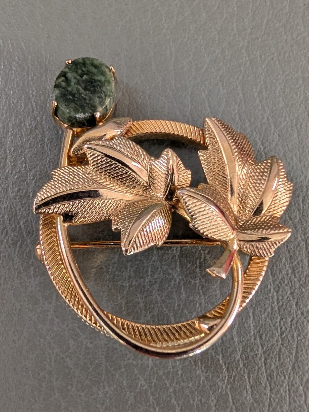 Gold-Tone Leaf Circle Brooch with Green Stone Accent